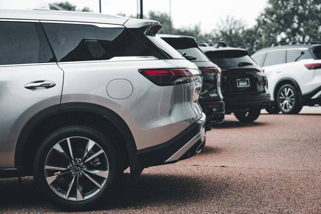 A row of cars parked in a parking lot